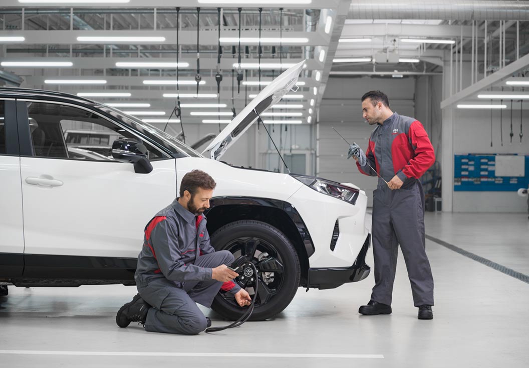Toyota technicians check tires and oil